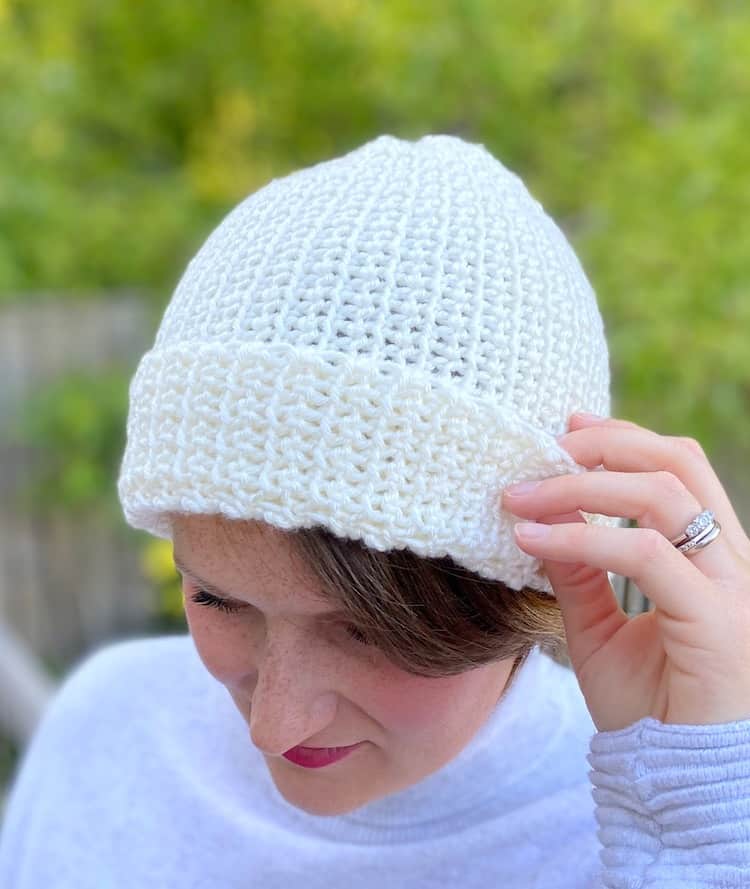 woman wearing cream crochet beanie hat 