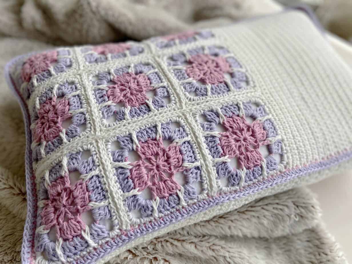 close up of crochet floral granny square motif on cushion