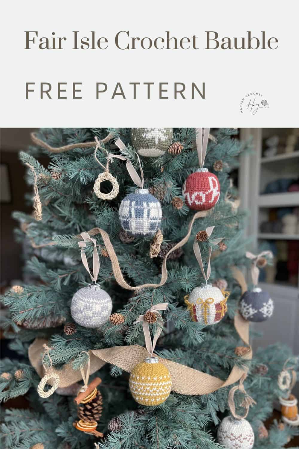 A Christmas tree decorated with various handmade Fair Isle crochet baubles in different colors and patterns. A sign above reads "Fair Isle Crochet Bauble Free Pattern.