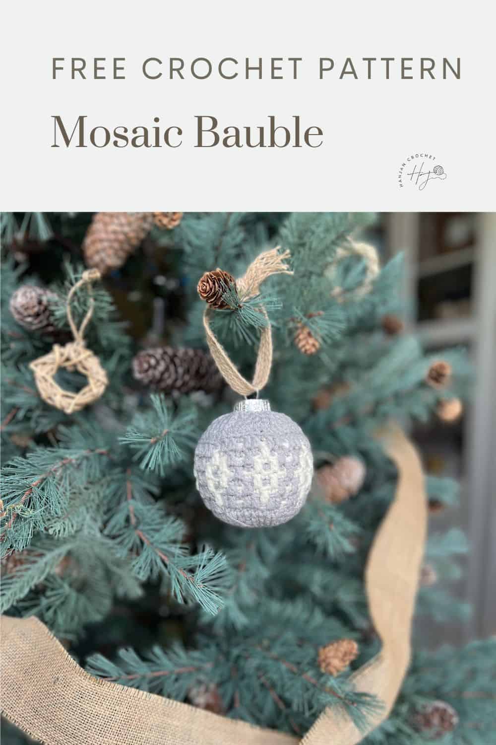 A Christmas tree adorned with a handmade mosaic crochet bauble ornament. The image advertises a free crochet pattern for the bauble.