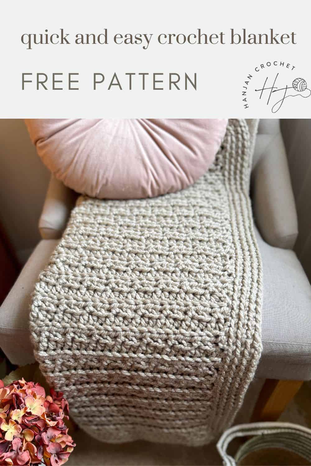 A chunky crochet blanket draped over the back of a beige chair with a pink round pillow. Text at top reads "quick and easy chunky crochet blanket FREE PATTERN" along with a logo on the right side.