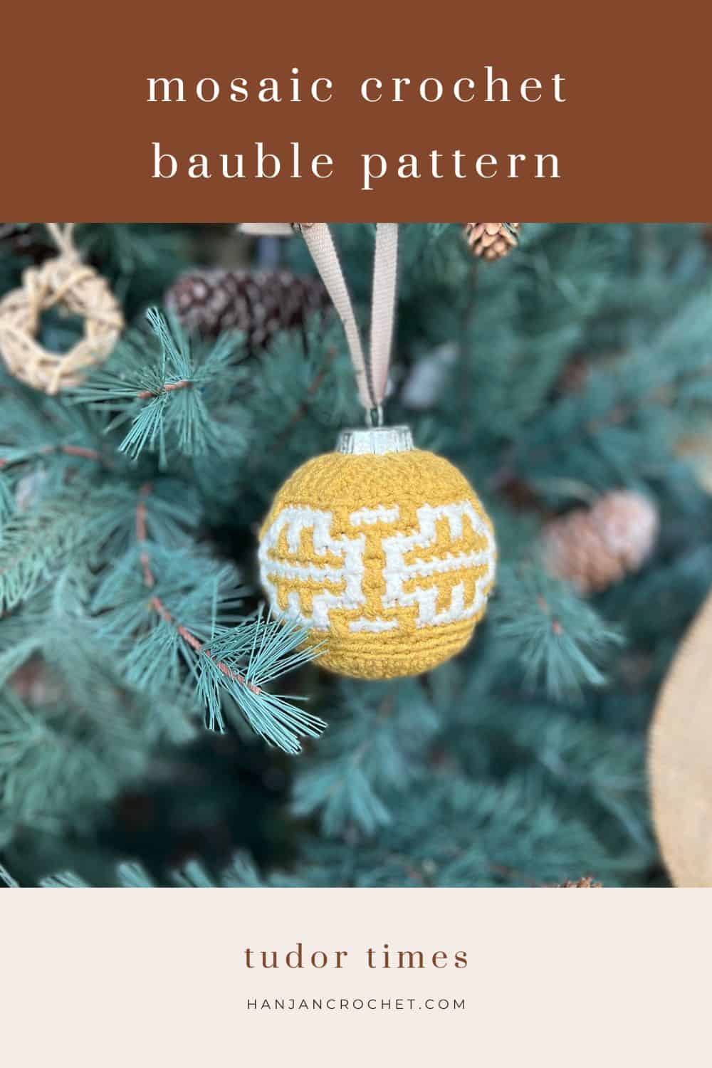 A yellow and white crochet bauble with a geometric pattern hangs on a pine tree. Text reads "easy mosaic crochet bauble" and "tudor times." Website: hanjancrochet.com.