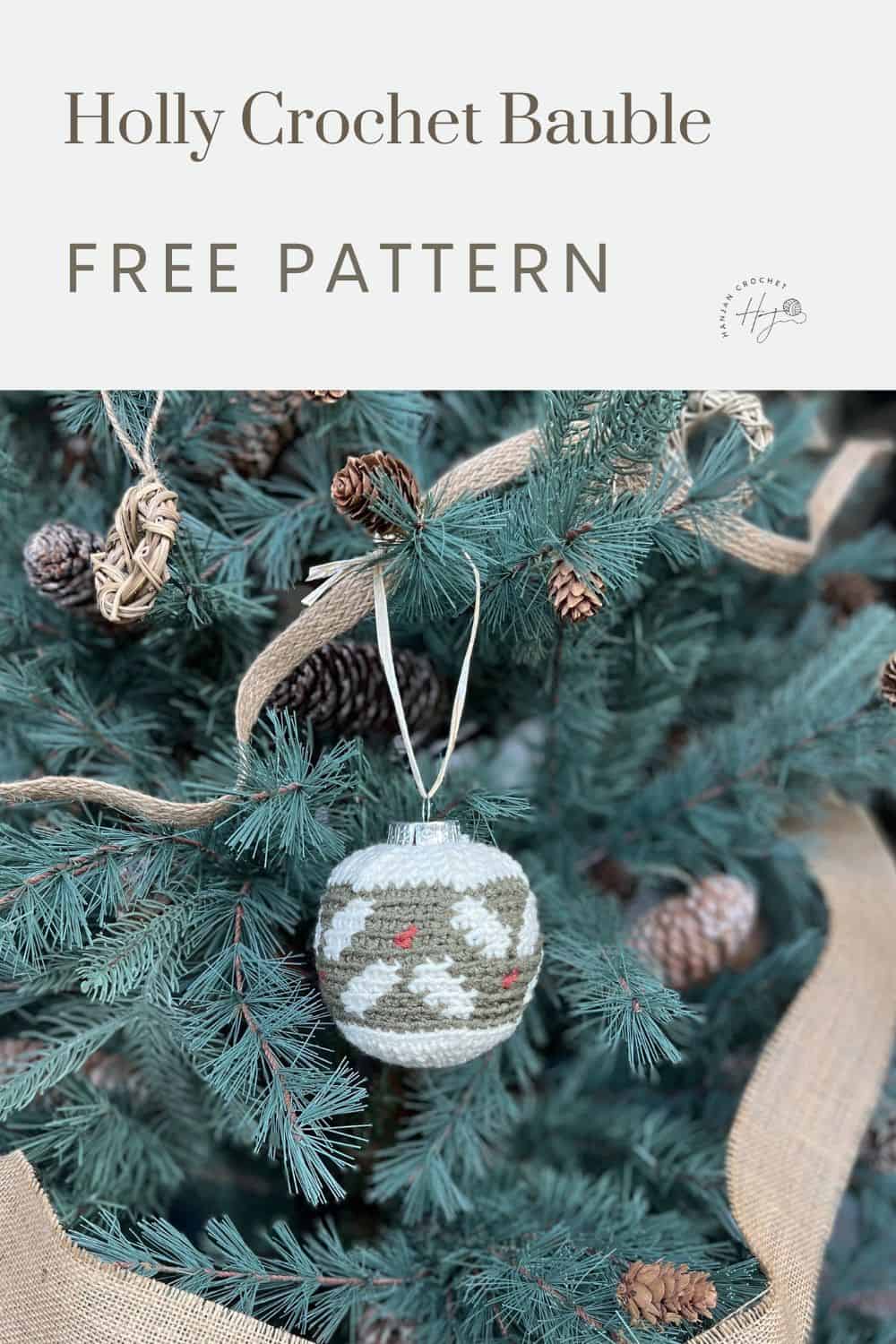 A crochet bauble with a holly design hangs on a Christmas tree. Text reads "Holly Tapestry Crochet Bauble FREE PATTERN.